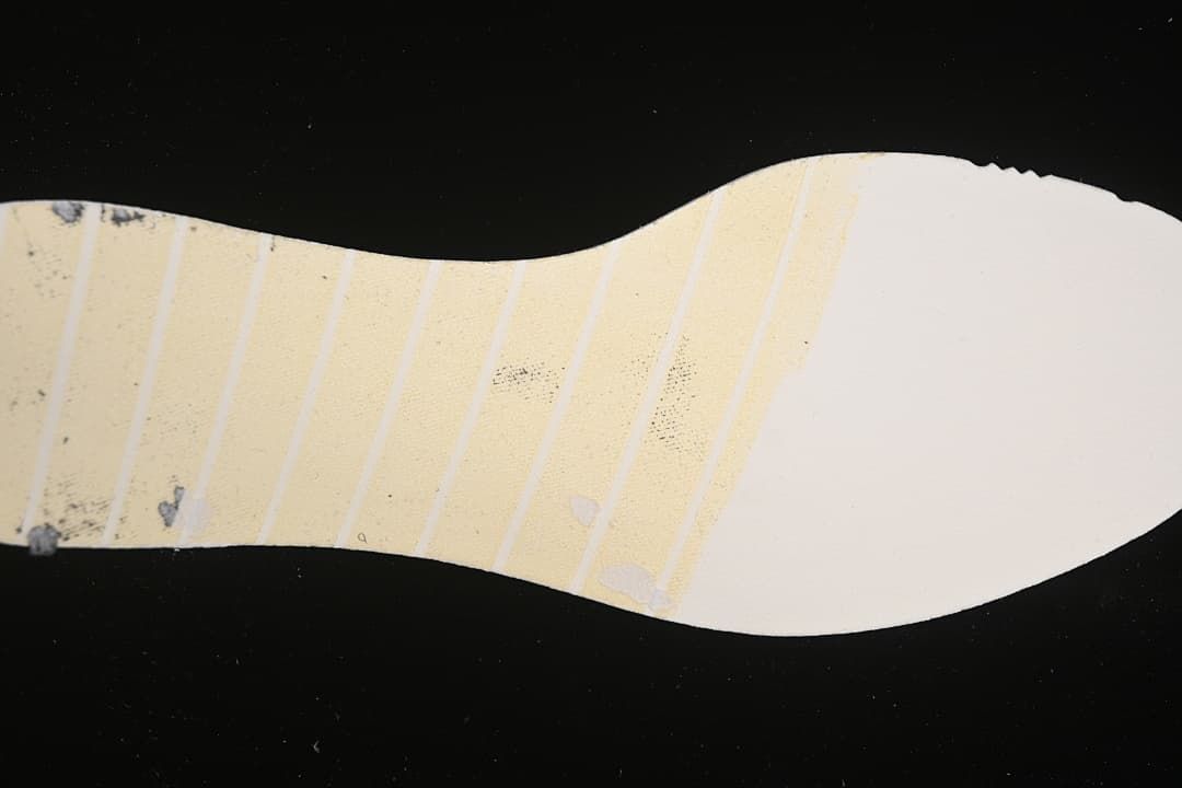 Underside detail showing the patterned outsole of the running shoe.
