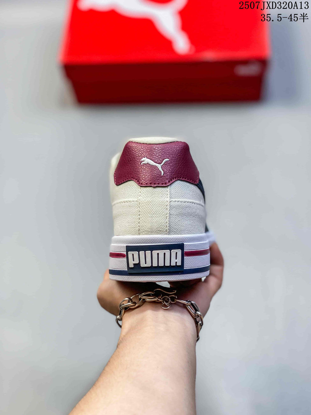 Rear view showing the burgundy heel tab and striped heel detail.