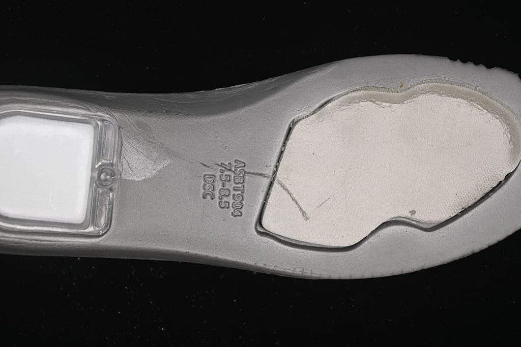 Close-up of the sneaker outsole with molded lettering.