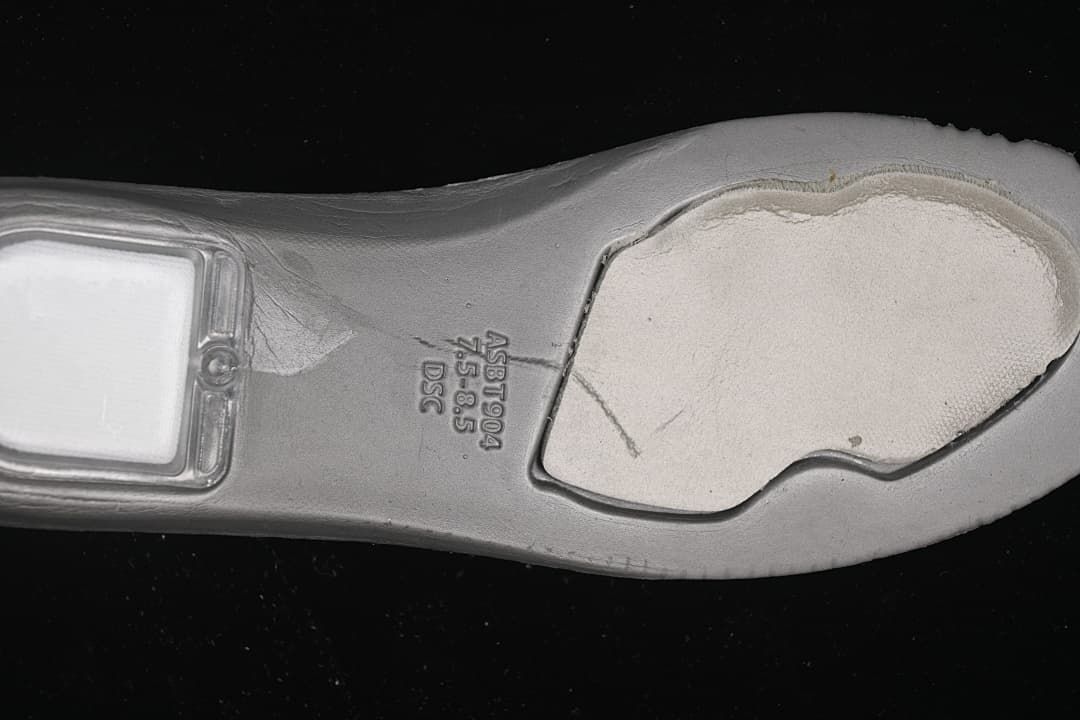 Close-up of the sneaker outsole with molded lettering.