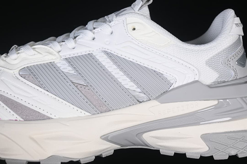 Close-up of the grey side stripes and sculpted midsole