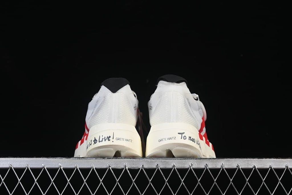 Rear view of both shoes showing heel lettering