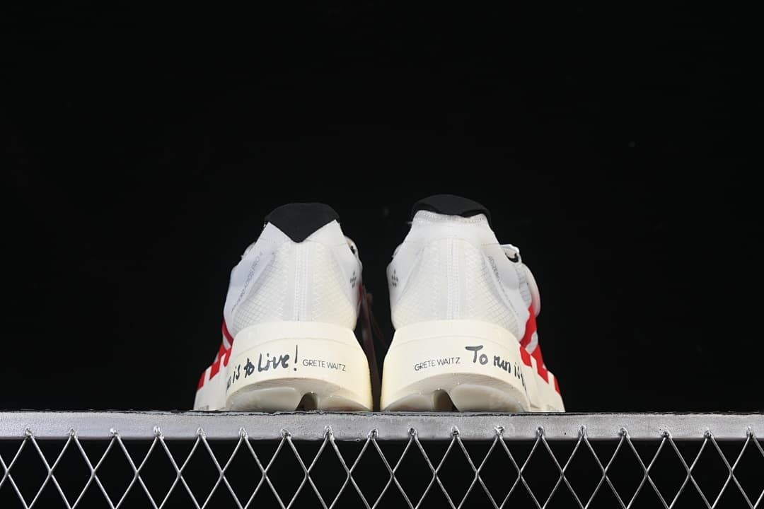 Rear view of both shoes showing heel lettering