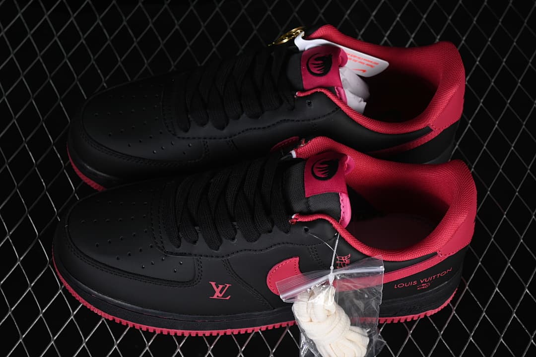 Pair of black and red low-top sneakers displayed together