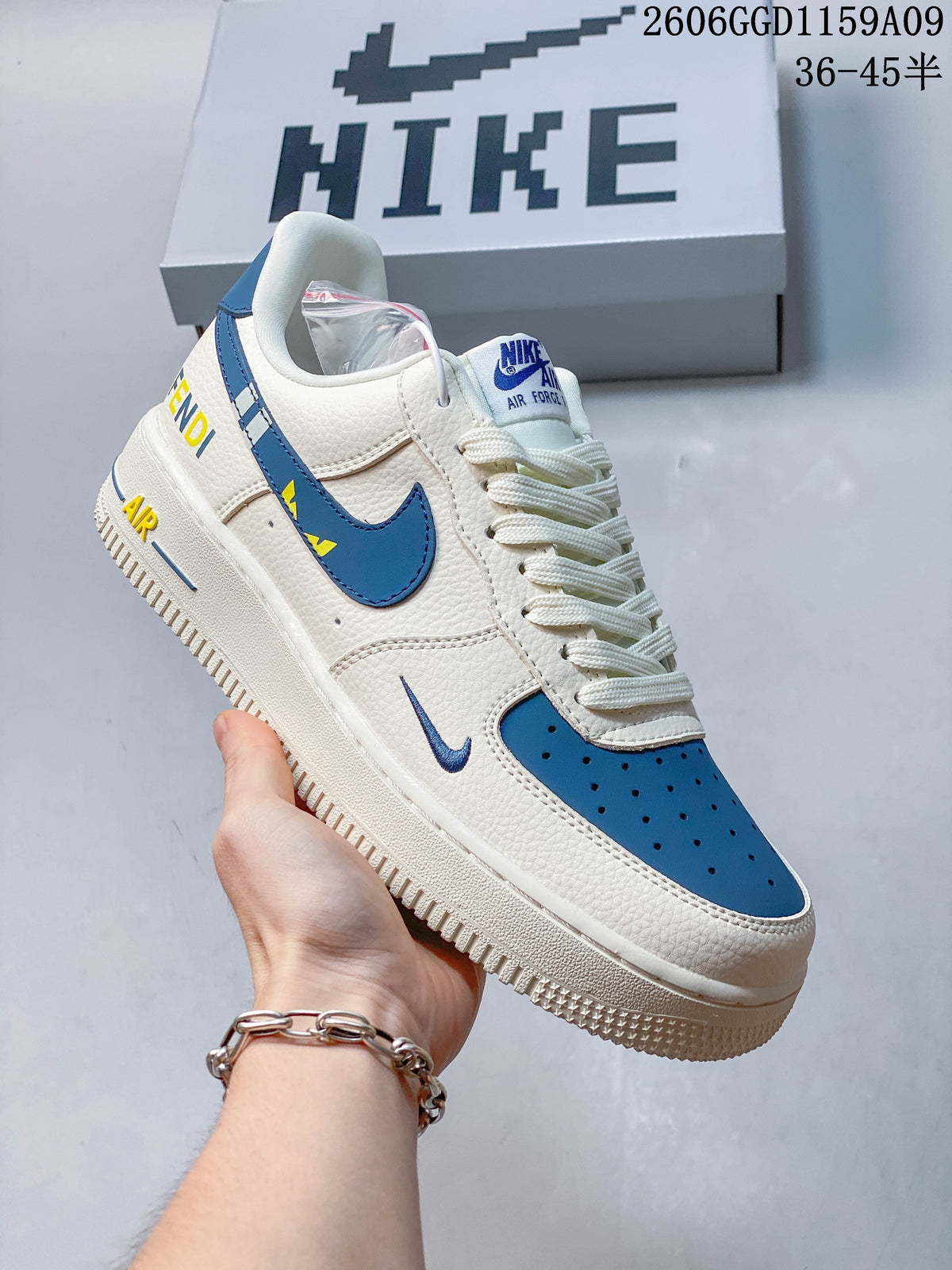 Angled side view showing blue Swoosh and heel accents