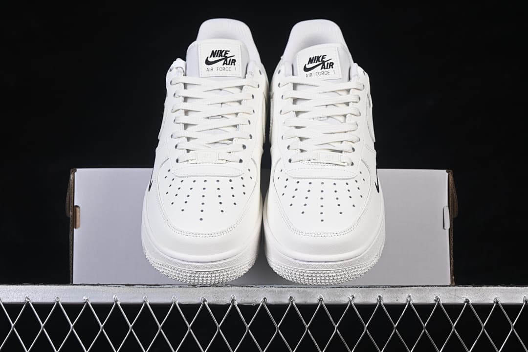 Front view of the pair highlighting perforated toe boxes and lace-up fronts