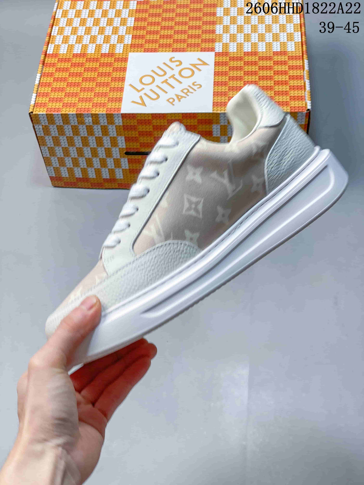 Side view of the low-top sneaker with patterned panels and a thick sole