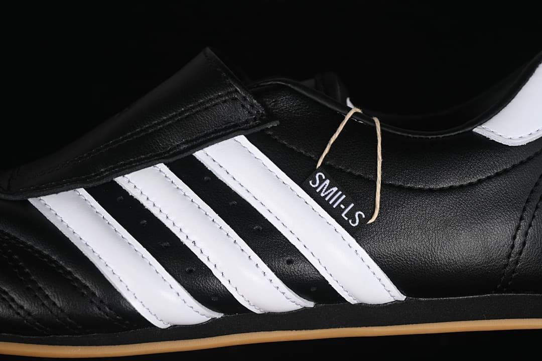 Close-up of the white side stripes, black upper, and attached tag.