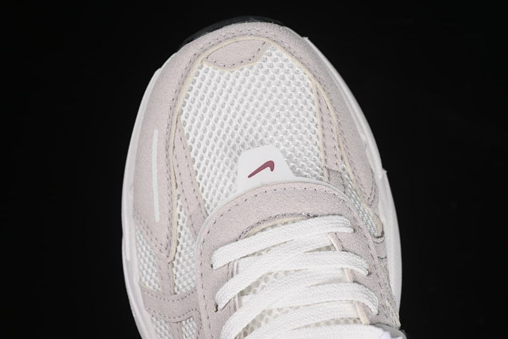 Top-down close-up of the mesh toe and lace area