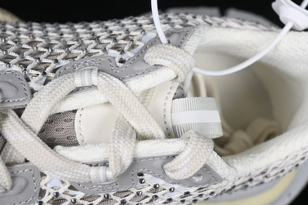 Close-up of the white laces and grey overlays