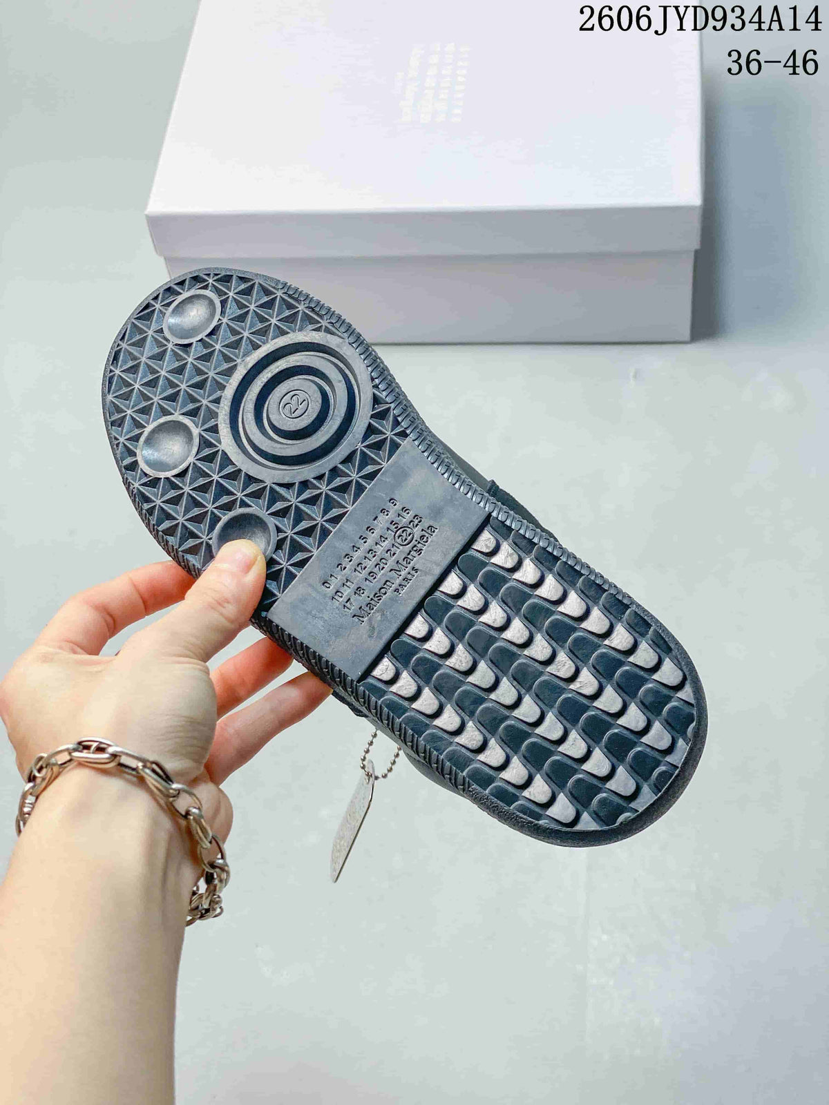 Close-up of the textured outsole on a dark navy sneaker