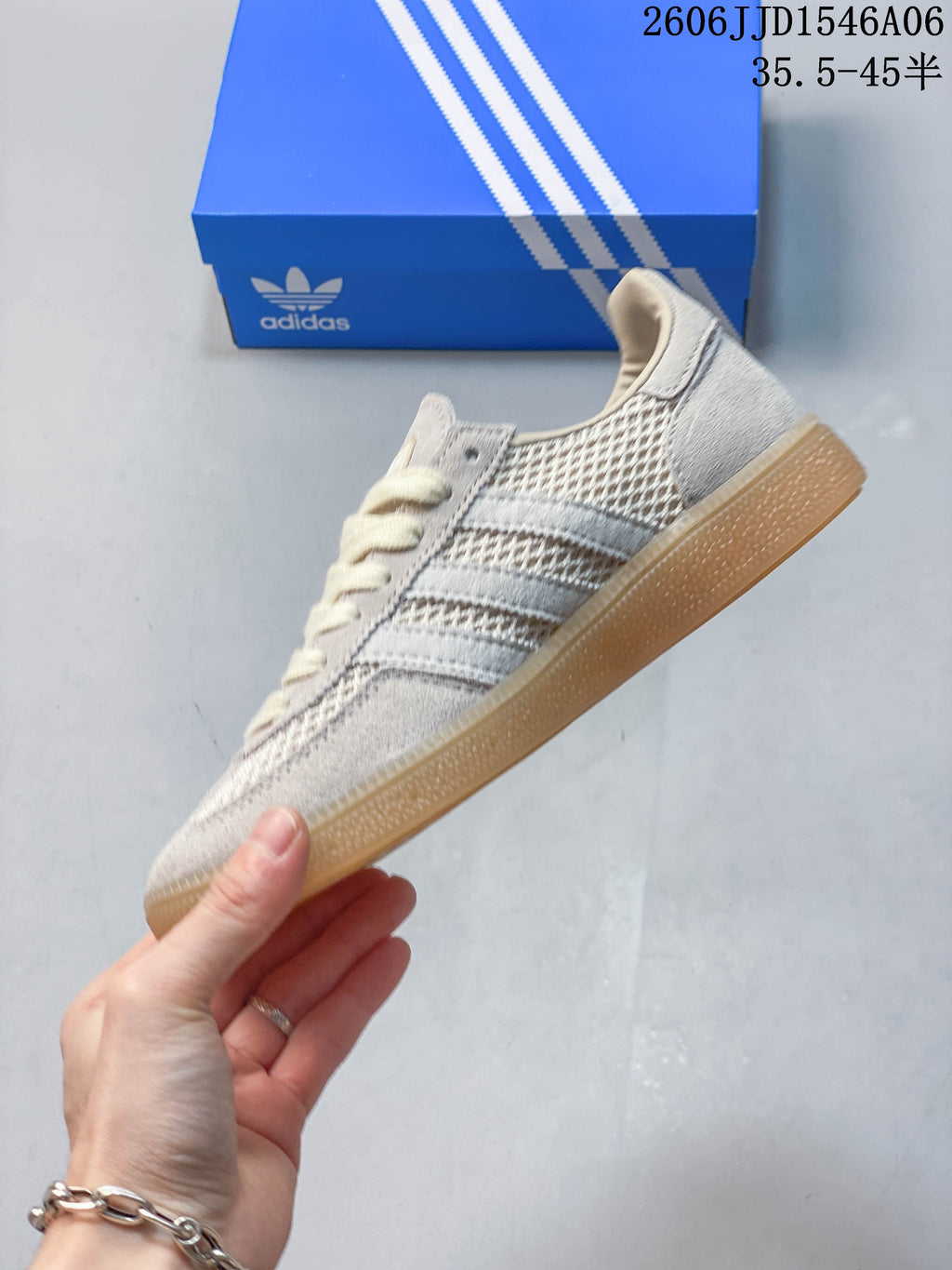 Side view of the sneaker with three stripes and textured panels