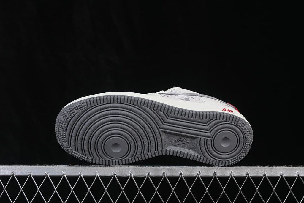 Underside view of the sneaker with a gray circular-pattern outsole