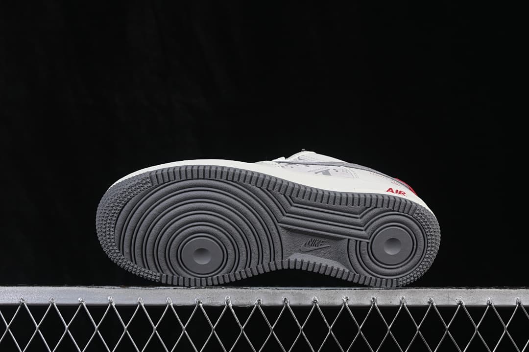 Underside view of the sneaker with a gray circular-pattern outsole
