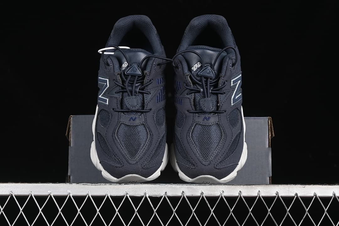 Front view of the pair of navy sneakers