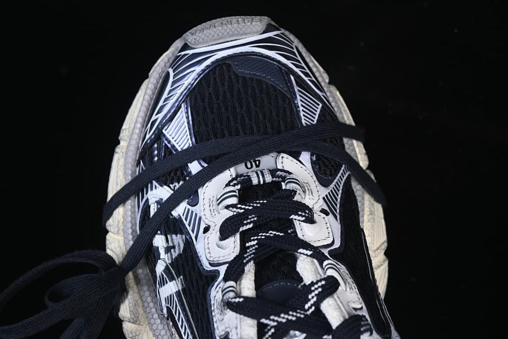 Top view of the sneaker highlighting its navy laces and patterned panels.