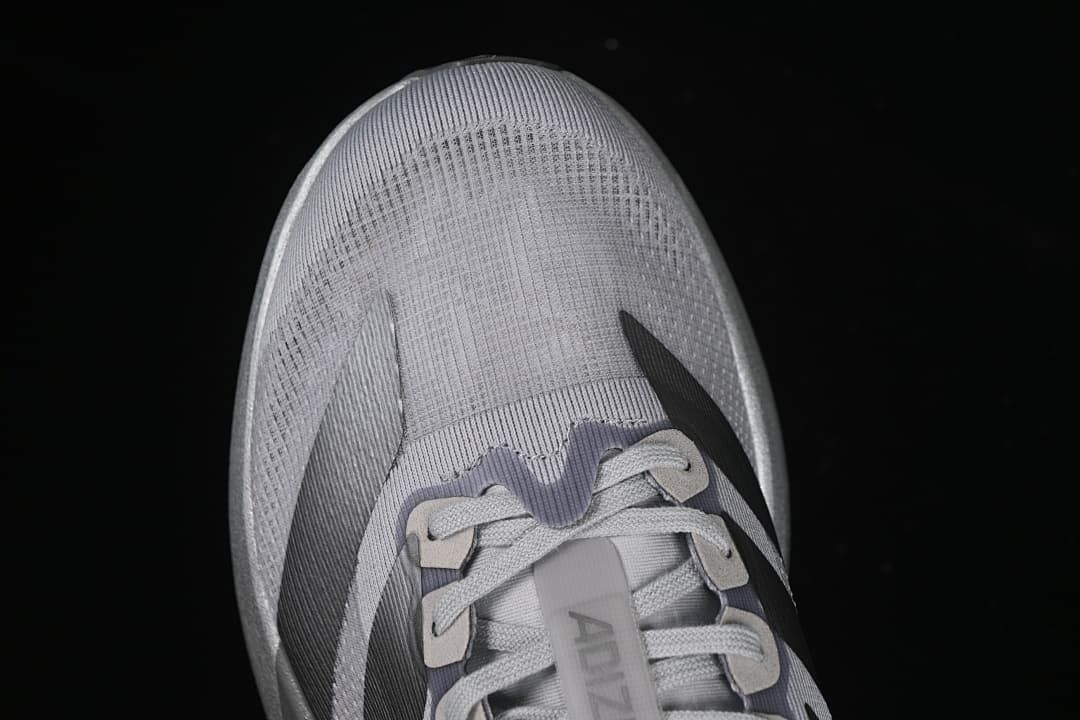 Top-down close-up of the toe box and lace area.