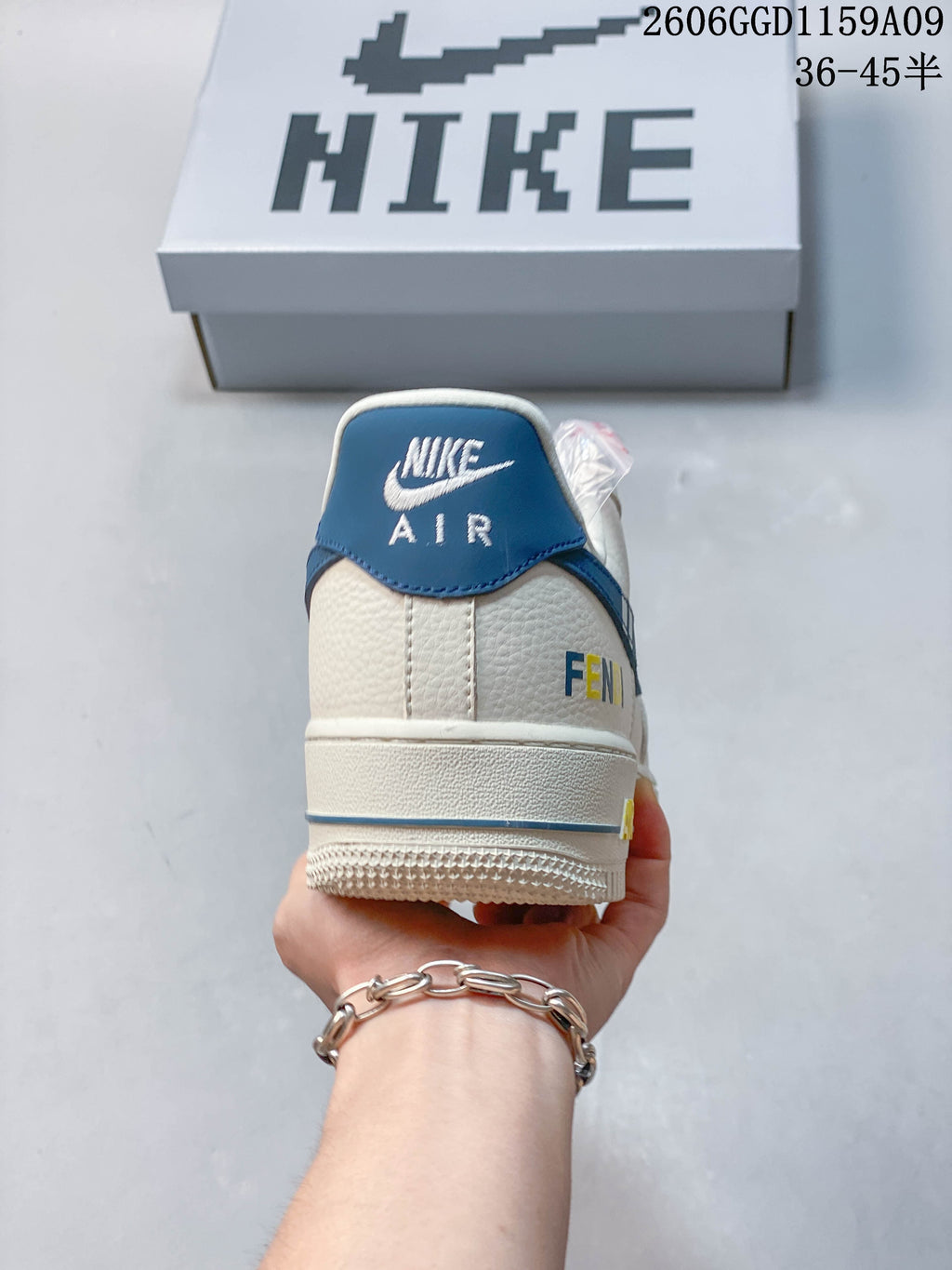 Rear view showing the blue heel tab and off-white upper