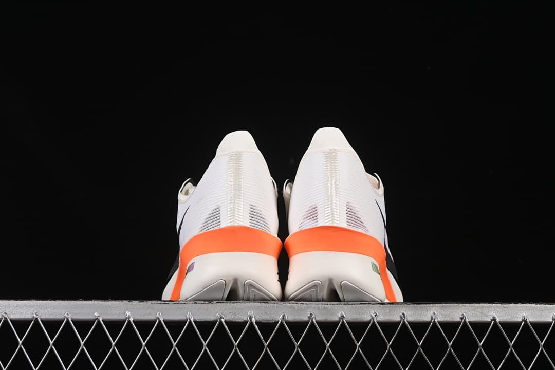 Rear view of the pair showing orange heel accents.