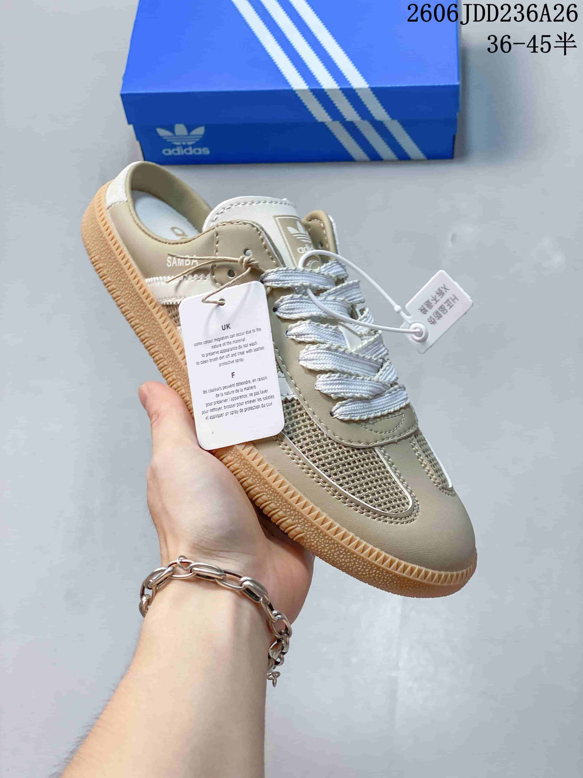 Close view of a beige Samba-style sneaker with mesh panels, brown accents, and an open heel