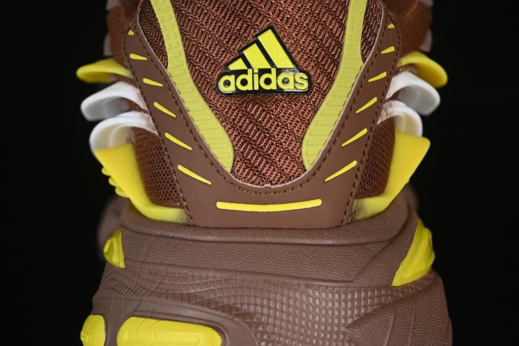 Rear view highlighting the heel counter, yellow accents, and sculpted sole