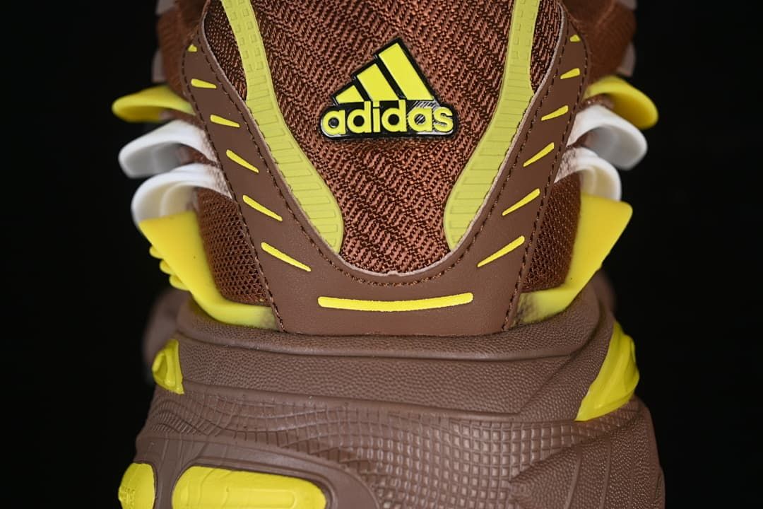 Rear view highlighting the heel counter, yellow accents, and sculpted sole