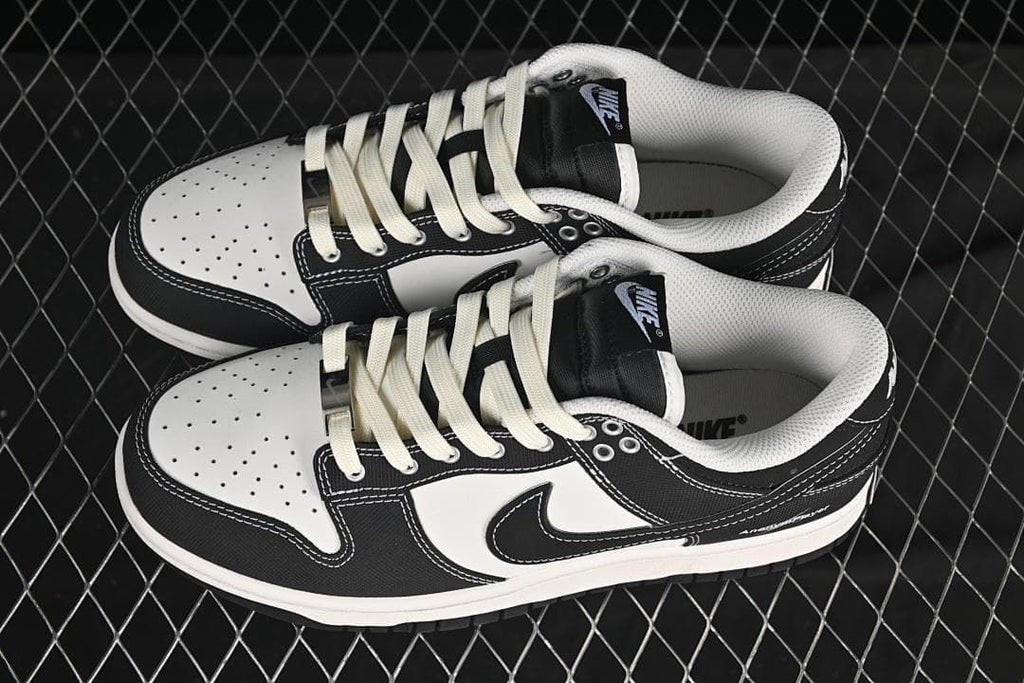 Pair of black-and-white low-top sneakers shown from above at an angle