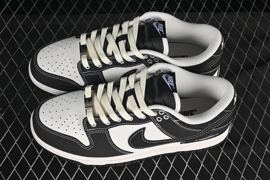 Pair of black-and-white low-top sneakers shown from above at an angle