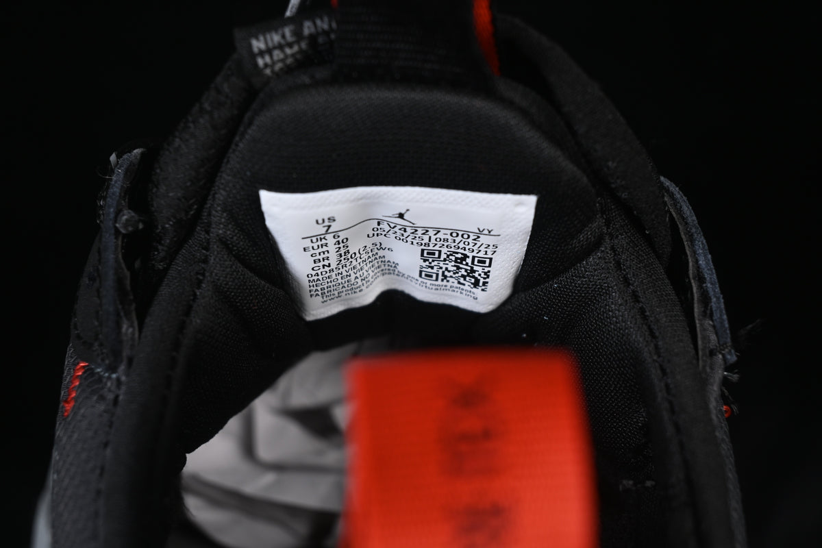 Inside shoe label displaying style code FV4227-002 and photographed sample size details