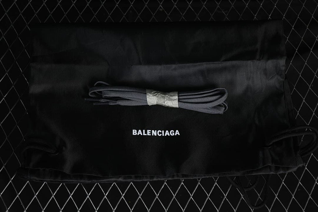 Black drawstring shoe bag and spare dark laces