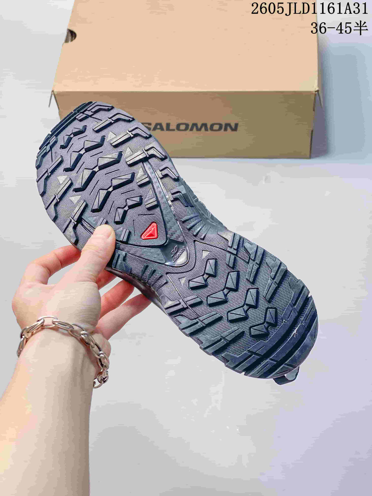 Close-up of the Salomon sneaker outsole showing a rugged tread pattern.