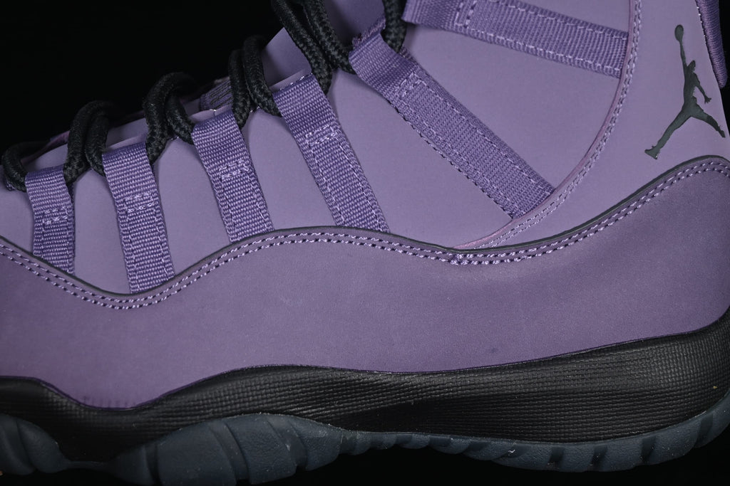 Side detail showing purple panels, lace loops, and dark outsole.