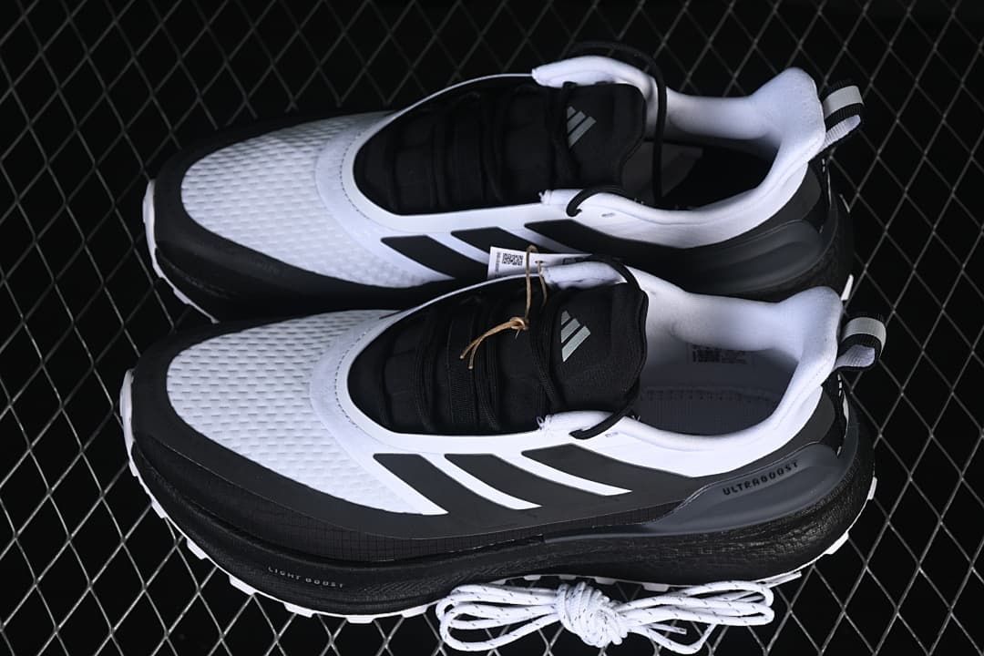 Pair of white and black shoes shown from above