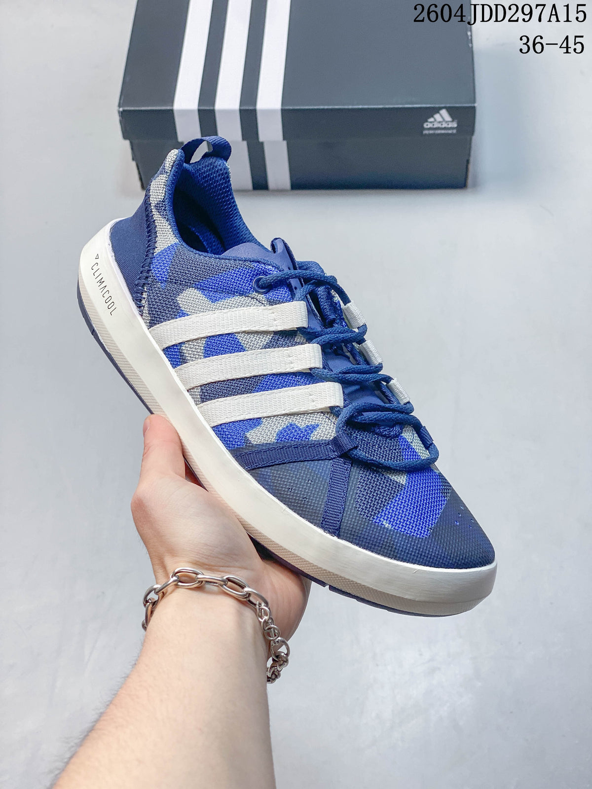 Angled side view of a blue-and-white Adidas Terrex CC Boat water shoe