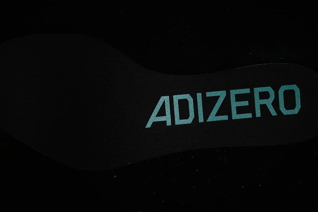Close view of the insole with Adizero branding.