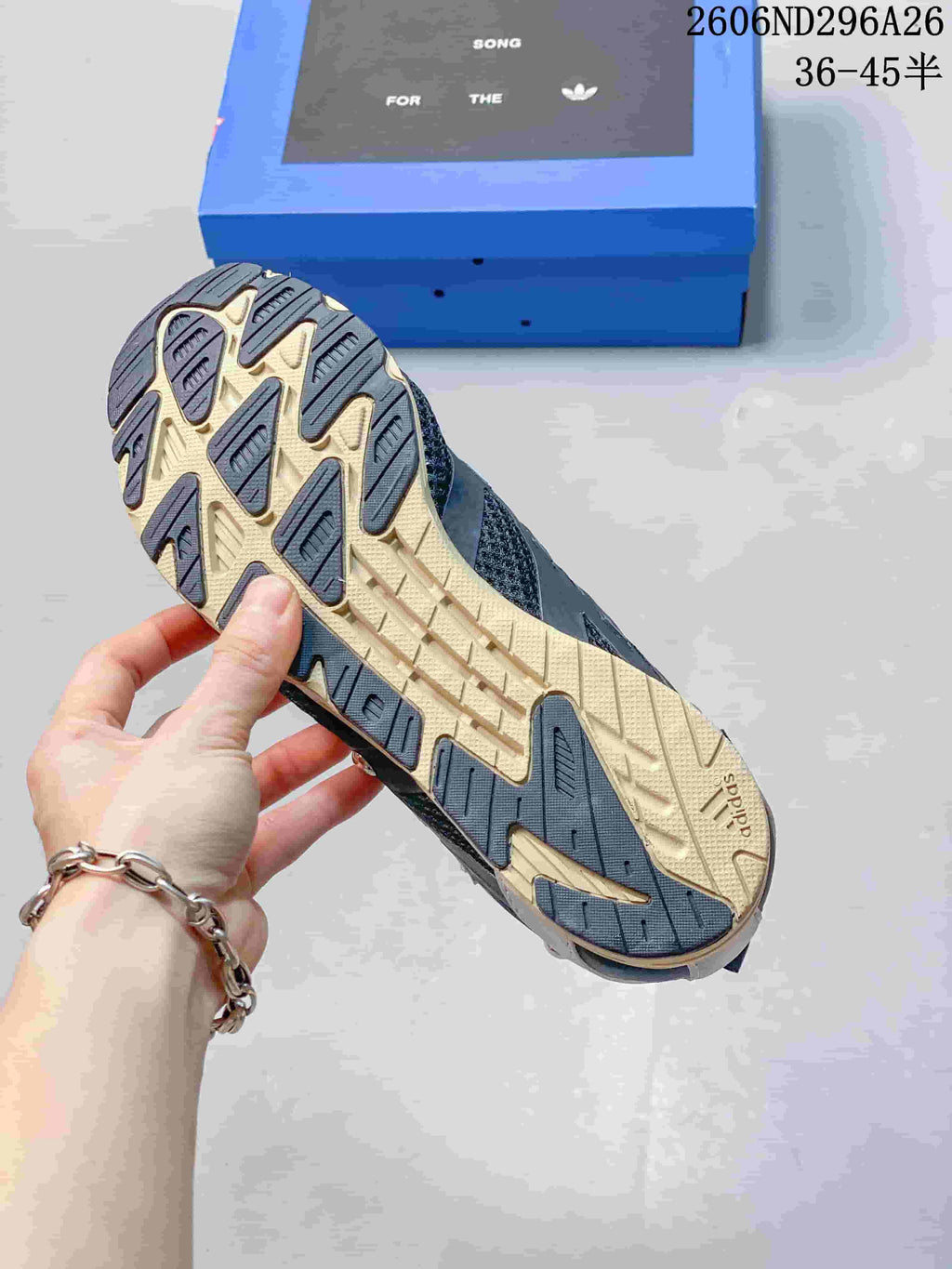Close-up of the sneaker outsole showing a two-tone tread pattern