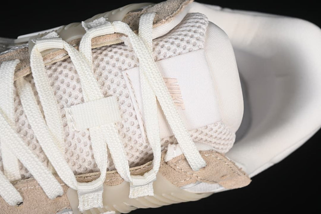 Close-up of laces, tongue, and mesh panels