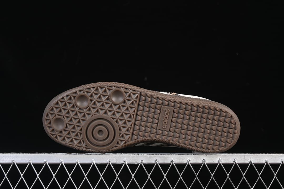 Underside view of the dark brown patterned sneaker sole