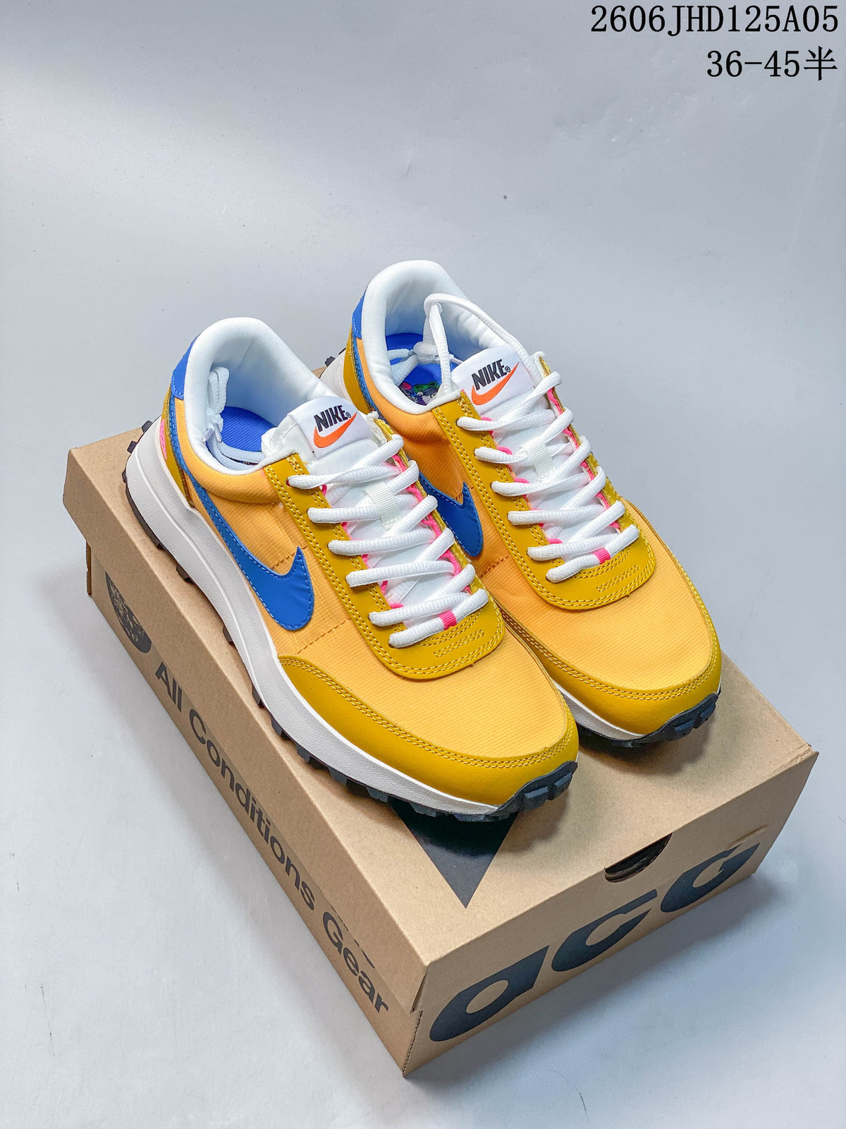 Pair of yellow Nike ACG LDV sneakers with blue accents
