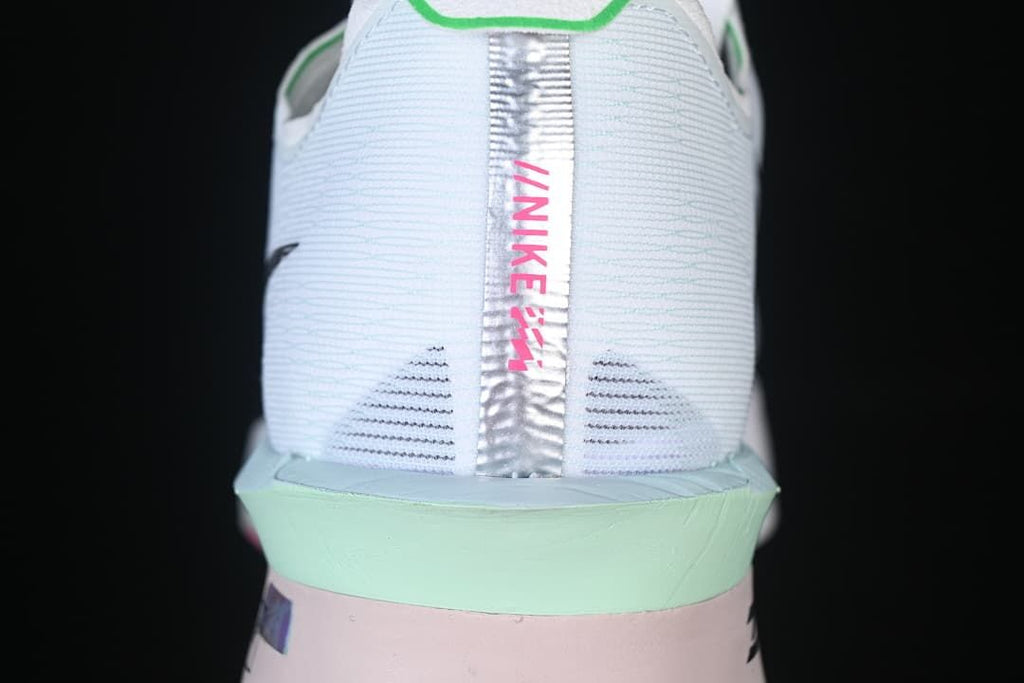 Rear view showing the heel panel and mint-accented midsole