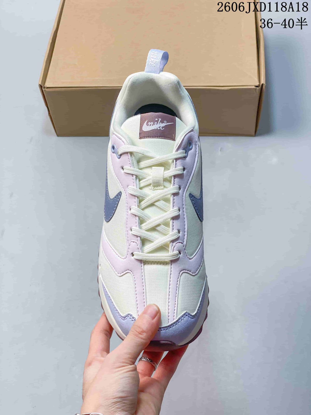 Top view showing the laces, tongue, and layered lavender overlays.