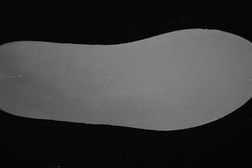 Close-up view of a plain grey shoe insert.