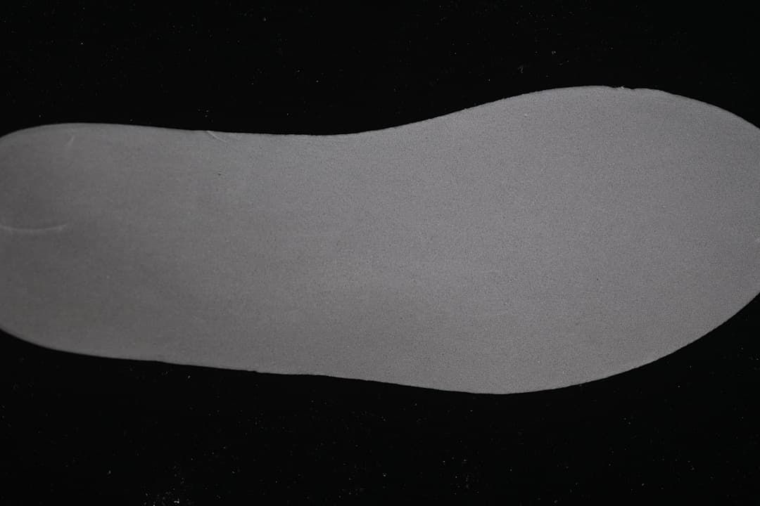 Close-up view of a plain grey shoe insert.