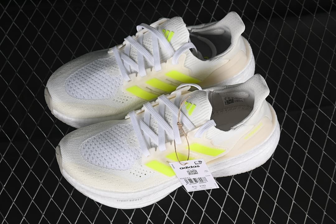 Pair of white and lime Ultraboost 5 shoes