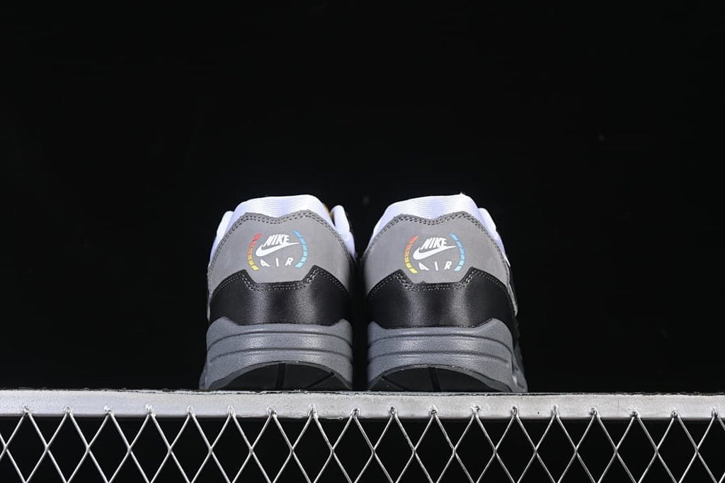 Rear view of both sneakers showing heel graphics and grey midsoles