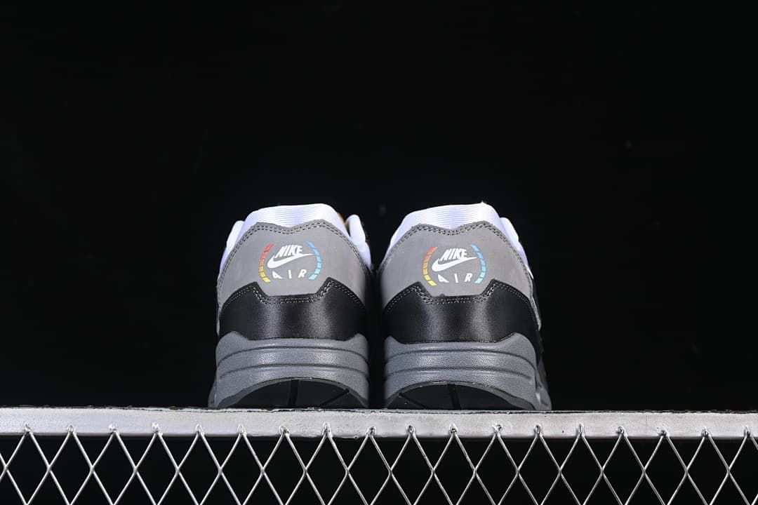 Rear view of both sneakers showing heel graphics and grey midsoles