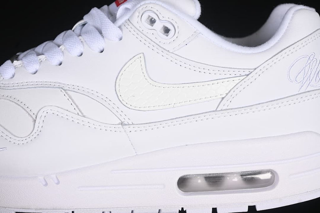 Side close-up showing the Swoosh, layered panels, and heel Air unit
