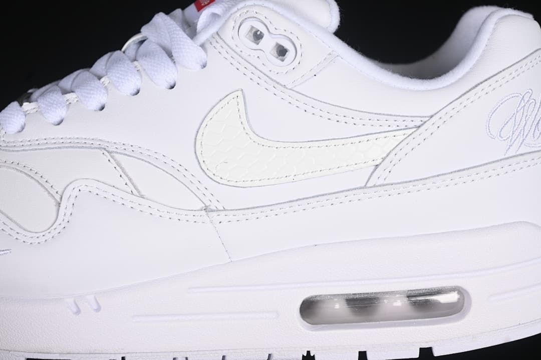 Side close-up showing the Swoosh, layered panels, and heel Air unit