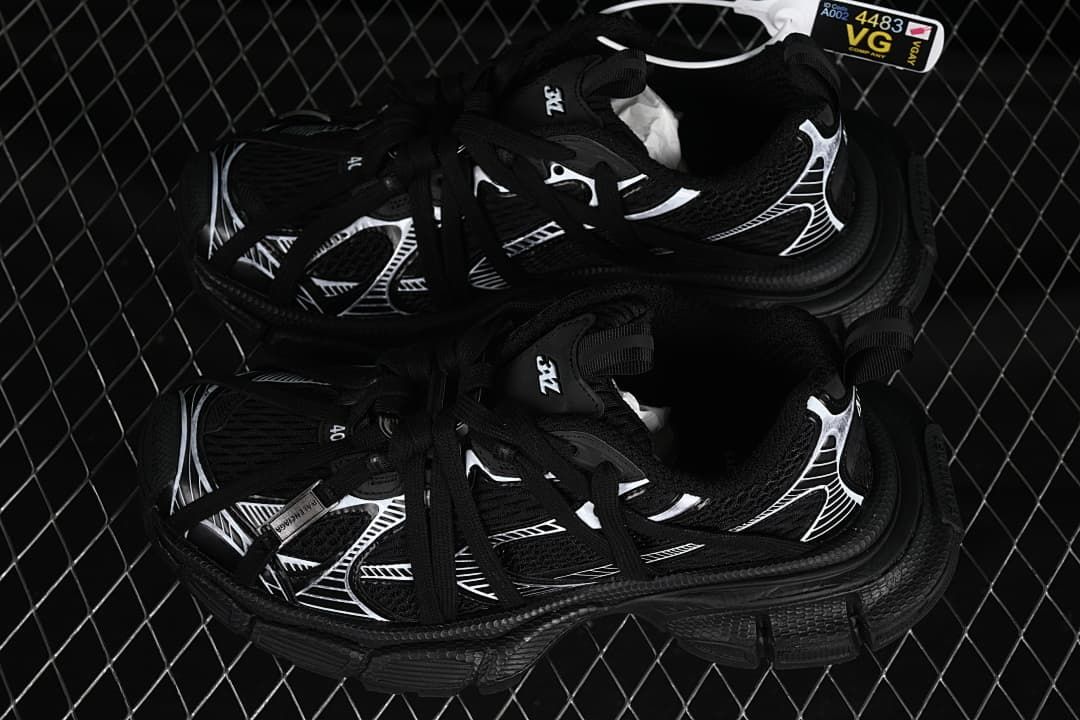Pair of black and white sneakers viewed from above.