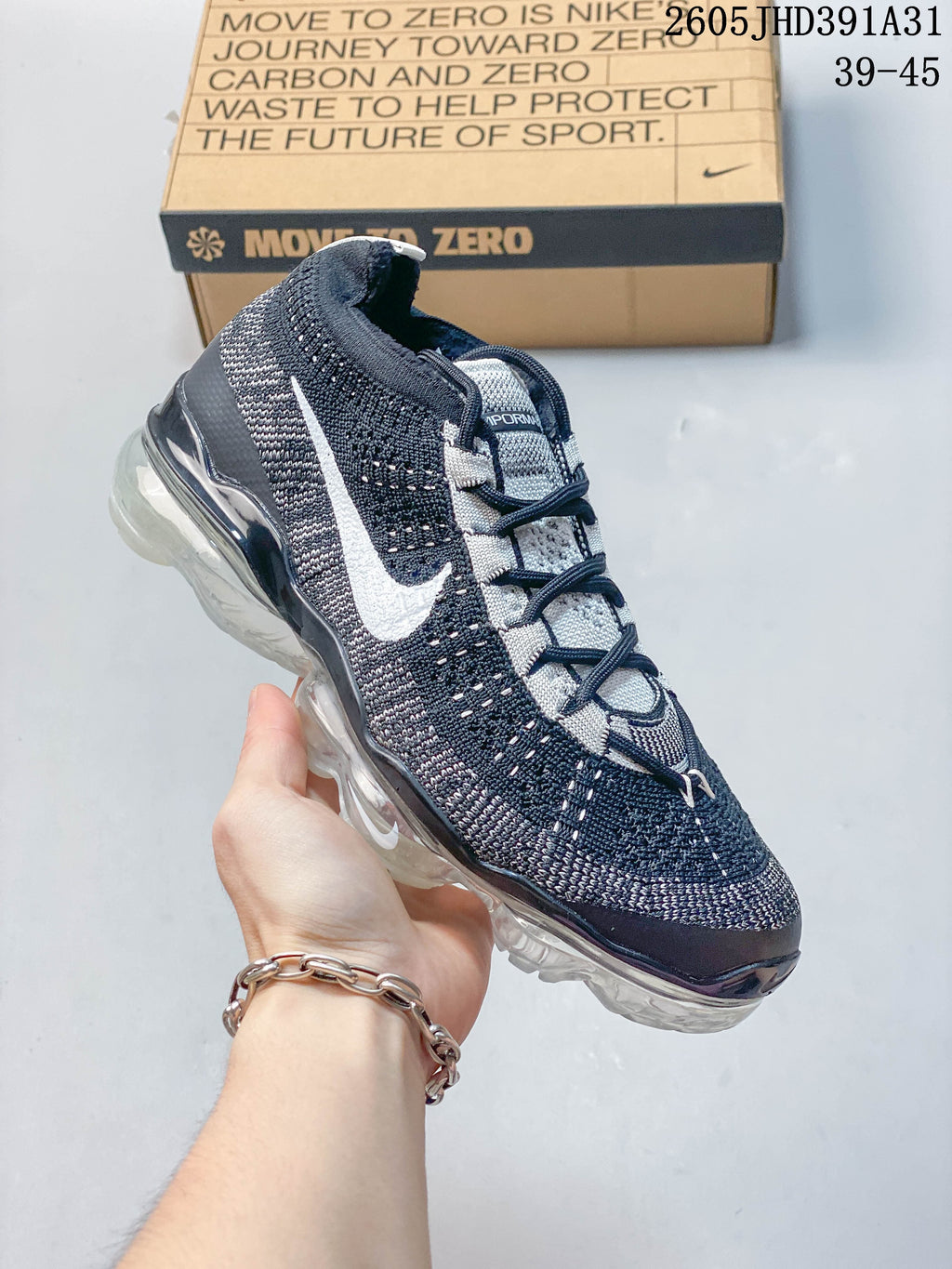 Navy Nike Air VaporMax 2023 Flyknit shoe shown from the front side; size range text appears in the image.